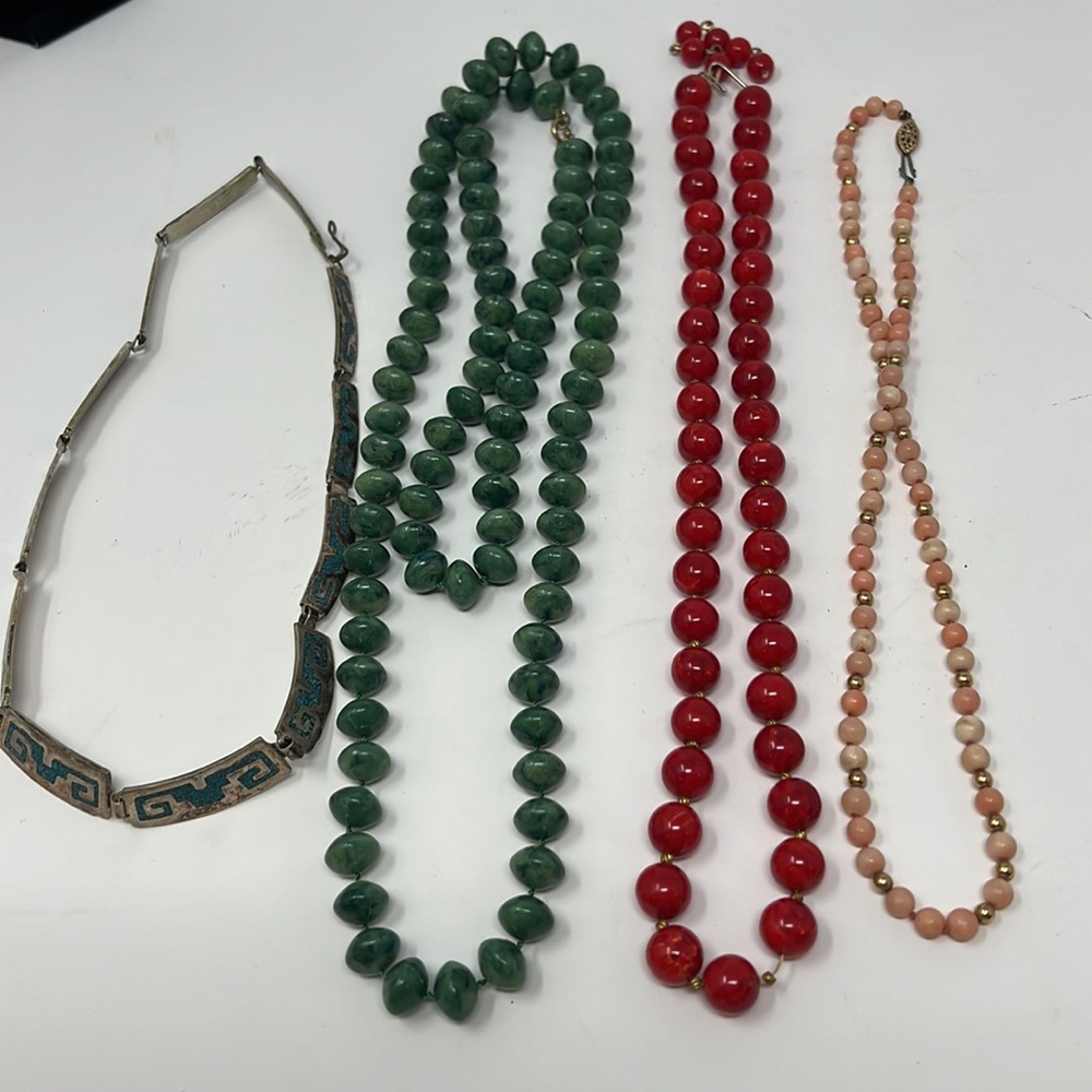 Four very vintage necklaces - green red pink